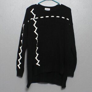 For the republic black acrylic sweater with vegan leather laced throughout